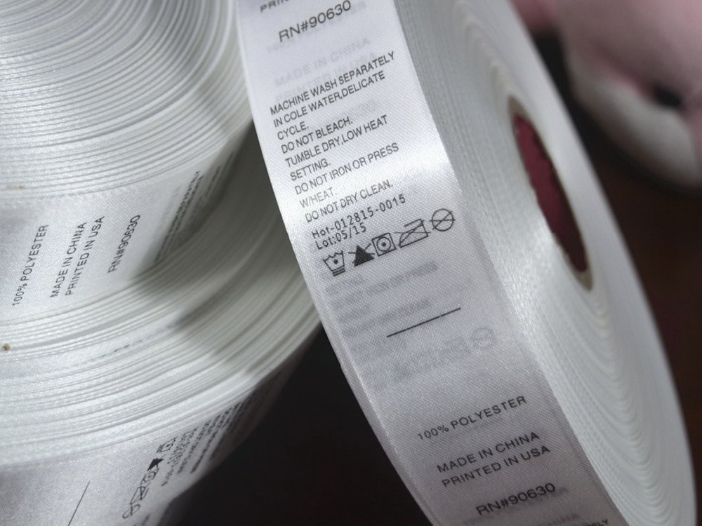 Close-up of crisply printed labels on a roll